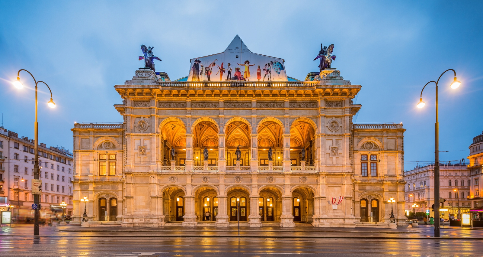 Vienna Opera House at dusk, highlighting its historic architecture. Join European Opera Tours in 2025 for the Wagner's Ring Cycle.